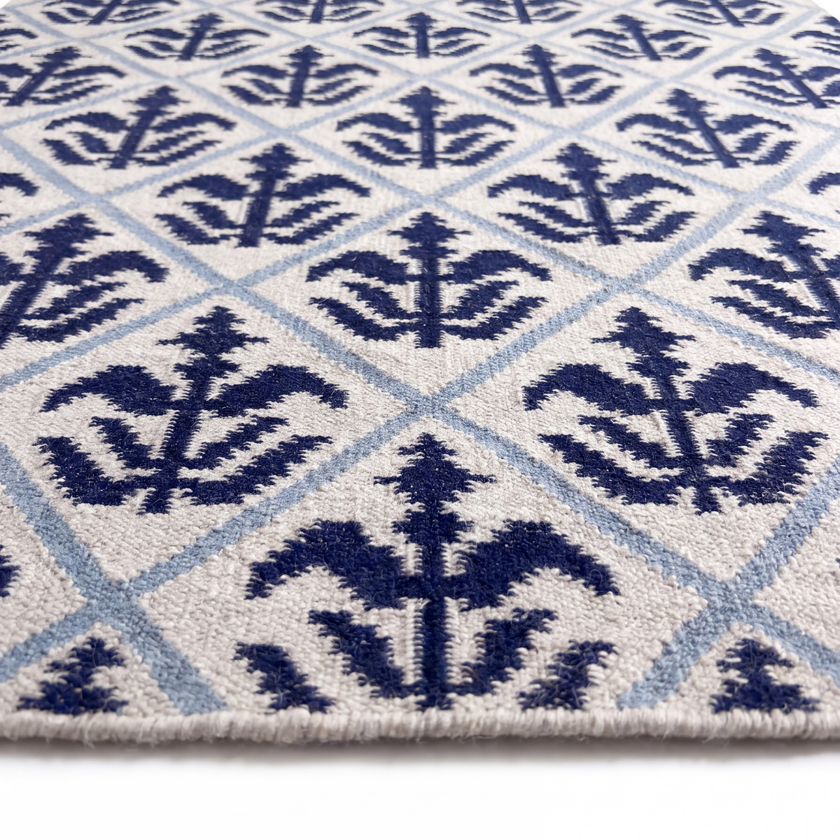 Girih Rug in Blue / Ivory — styled angle