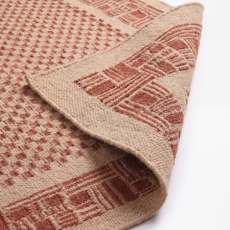 Qila Rug in Ivory / Brown — styled angle