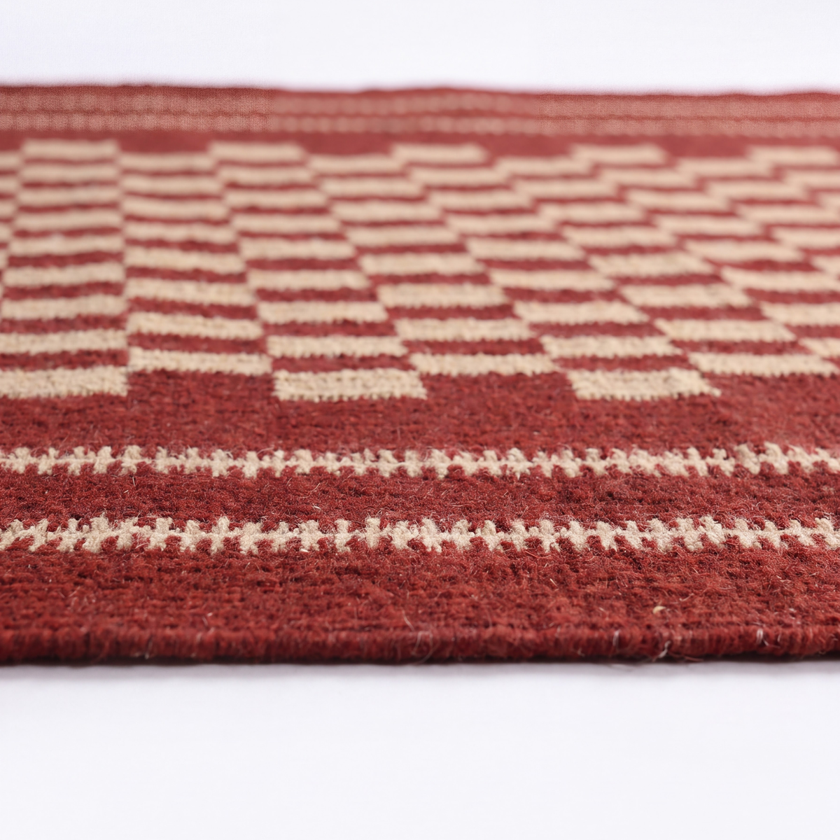 Tarz Rug in Brick / Pristine — styled angle